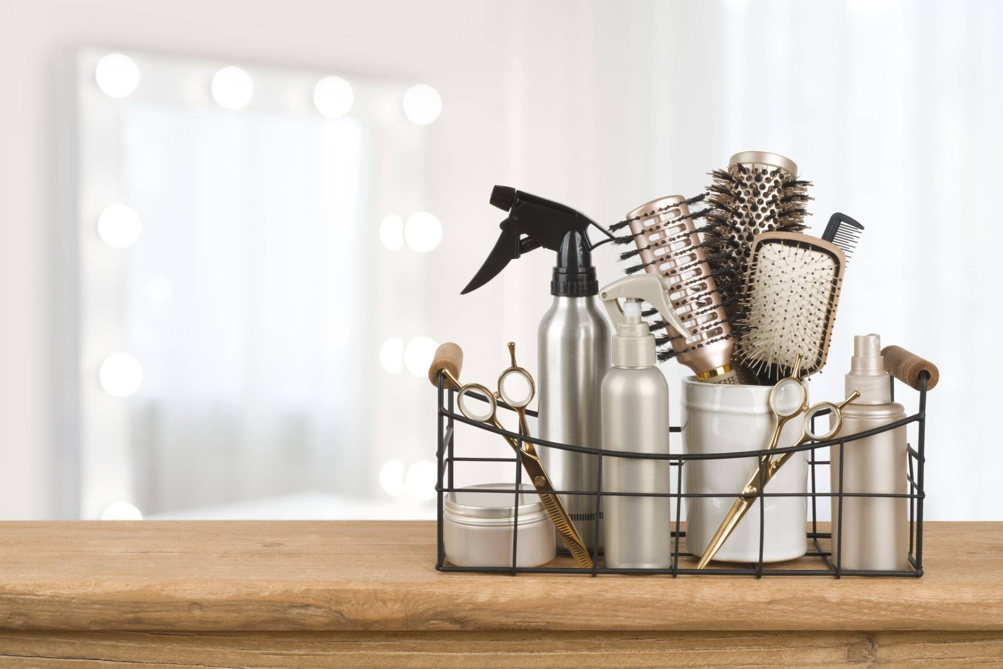 Hairdresser tools on wooden table with blurred beauty salon background Hairdresser tools on wooden table with blurred beauty salon background