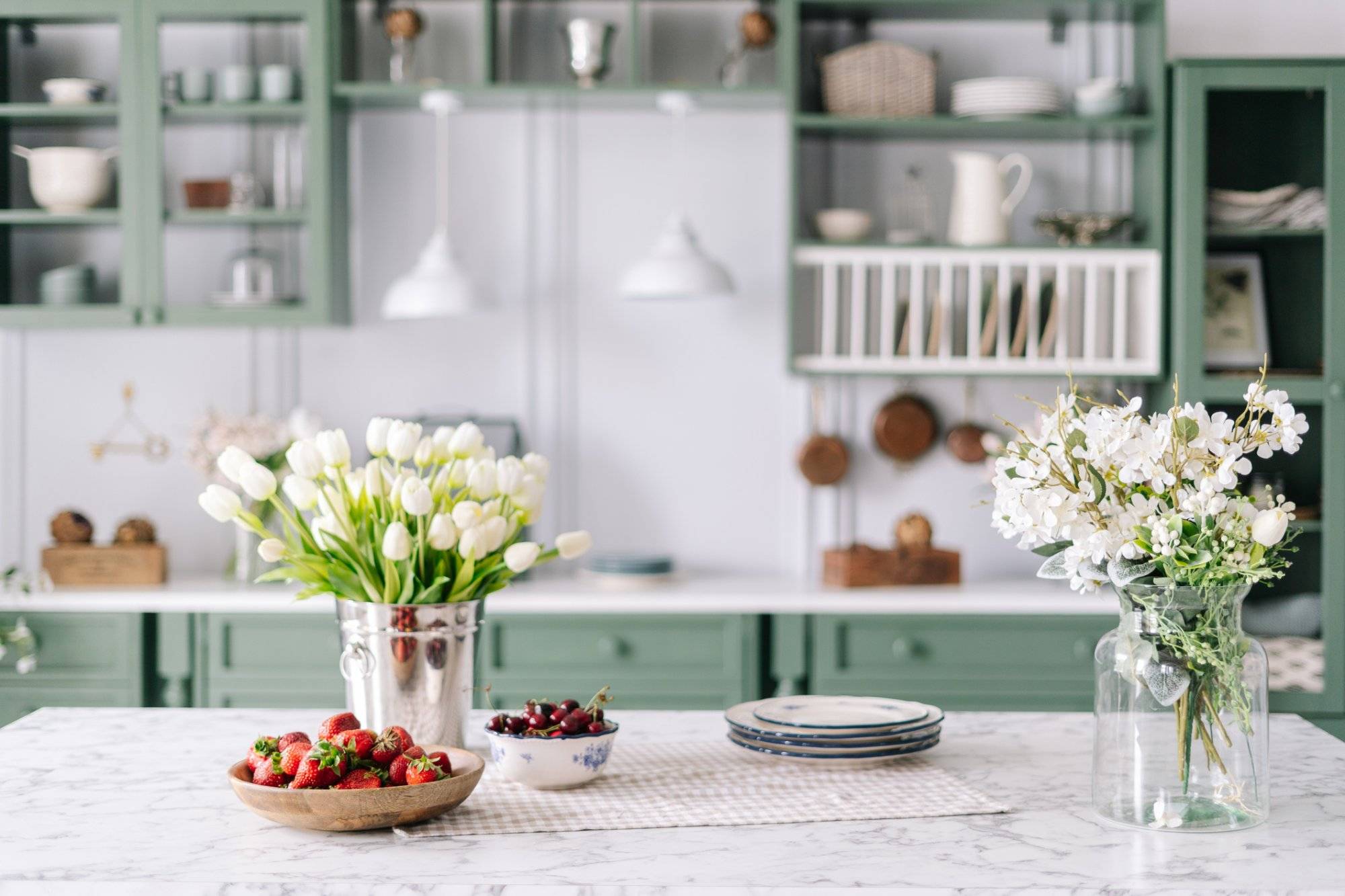 Kitchen countertop with flowers in bucket and jar Kitchen countertop with flowers in bucket and jar