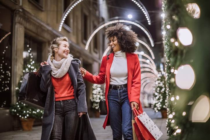 Two Attractive Young Women In Christmas Shopping